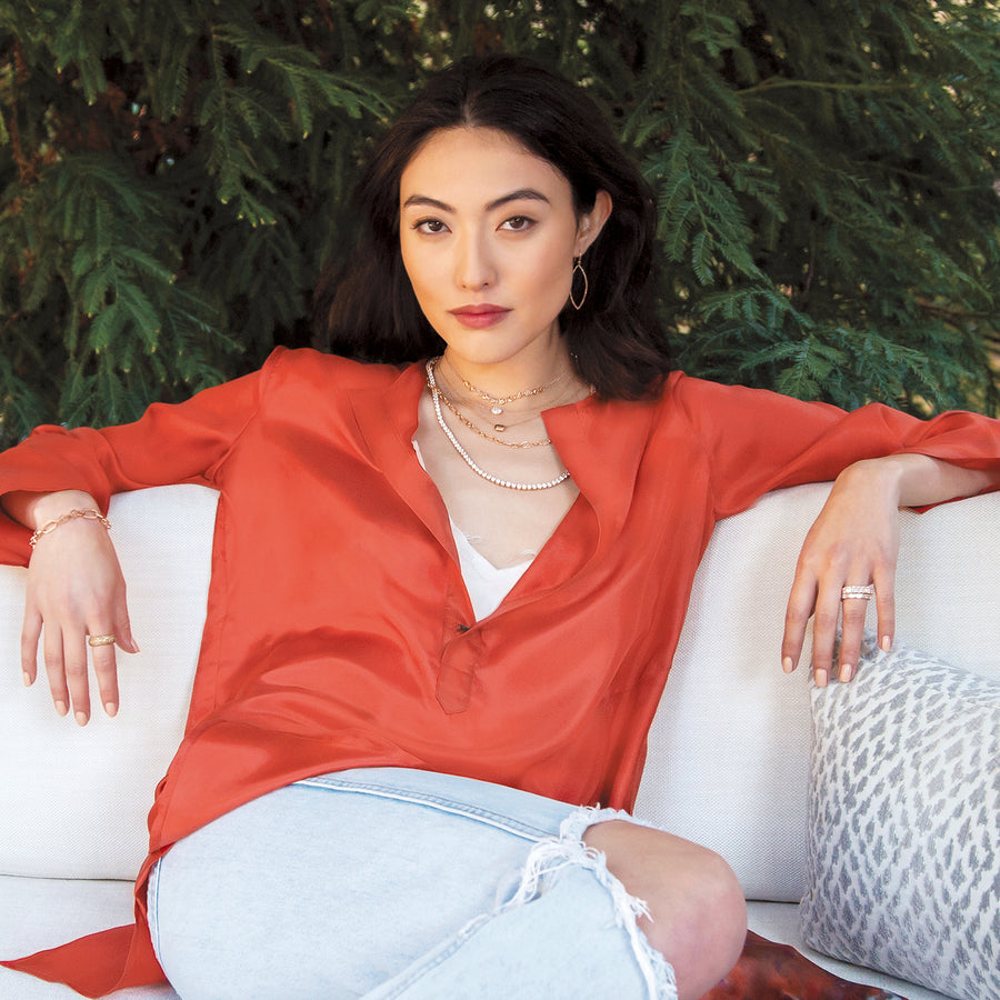 Stylishly relaxed woman wearing Dominique Cohen silk apparel + diamond and champagne diamond necklaces, rings, earrings, bracelet; 323-404-2959 for shopping help